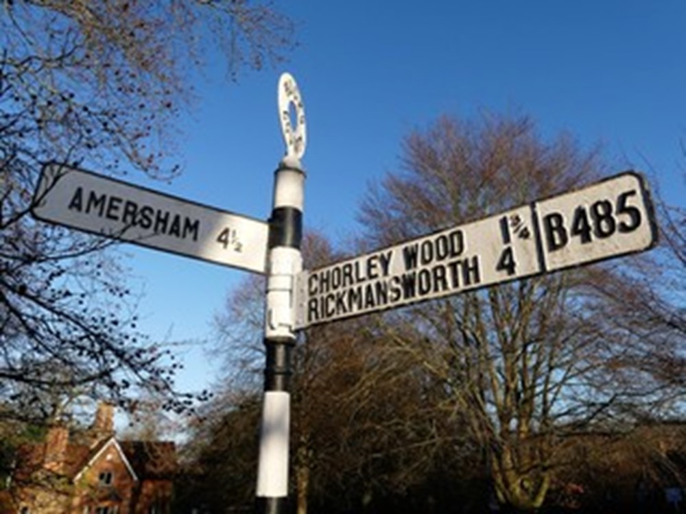 roadsign showing amersham and chorley wood