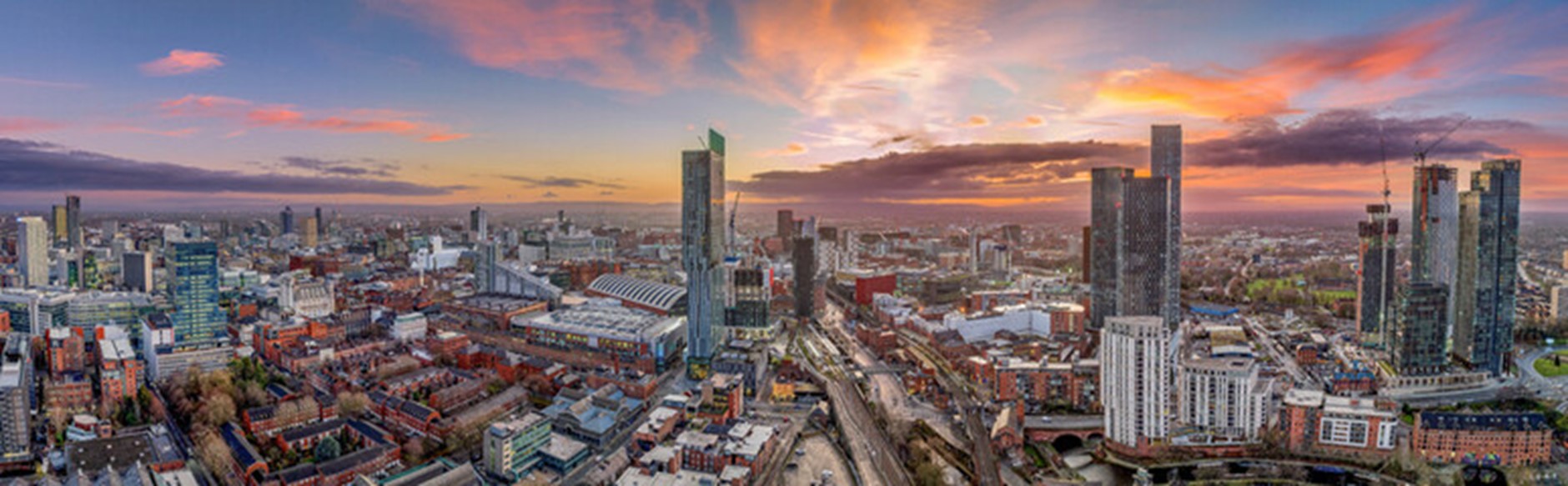 the manchester skyline at sunset
