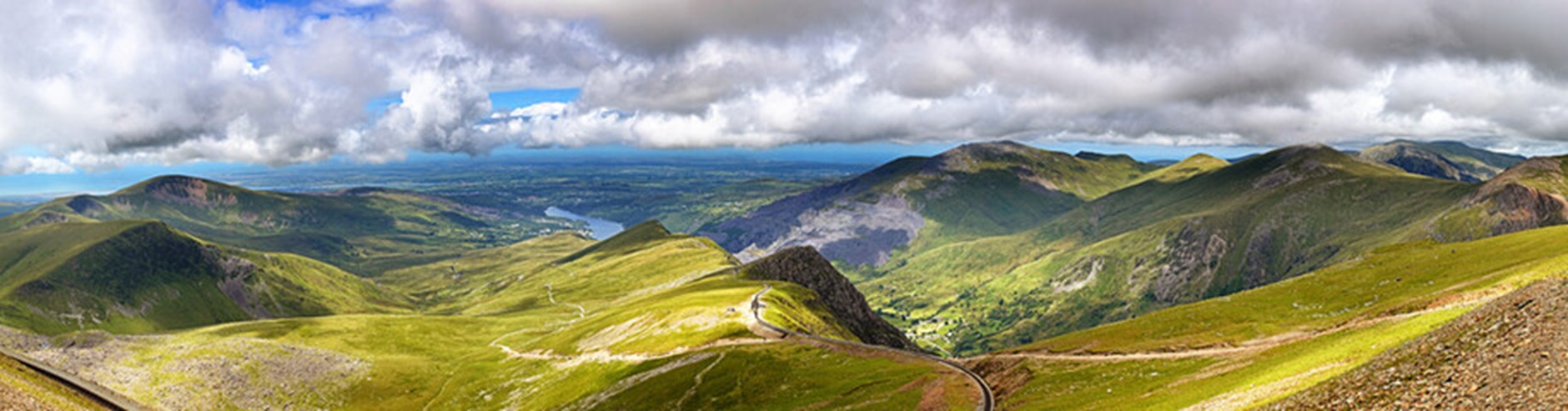 snowdon and surrounding mountains in the sunshine